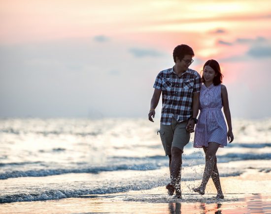 Couple Walking on Beach